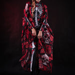 Woman wearing the Red Monarchy Butterflies kimono cape, featuring detailed butterfly accents and a flowing design, perfect for Day of the Dead or Halloween events.