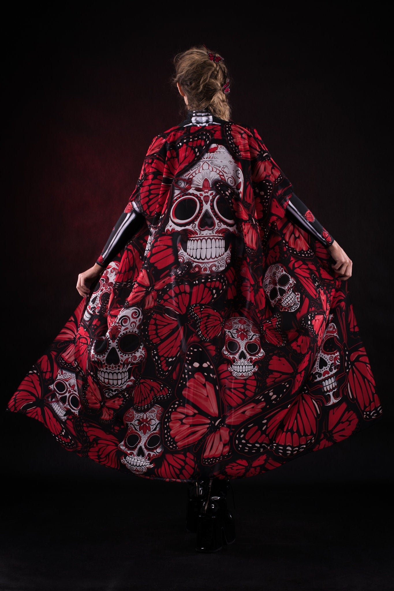 Woman posing in the Red Monarchy Butterflies Halloween kimono cape, showcasing the bold butterfly design and elegant flow, ideal for Halloween parties or as a standout festival outfit.