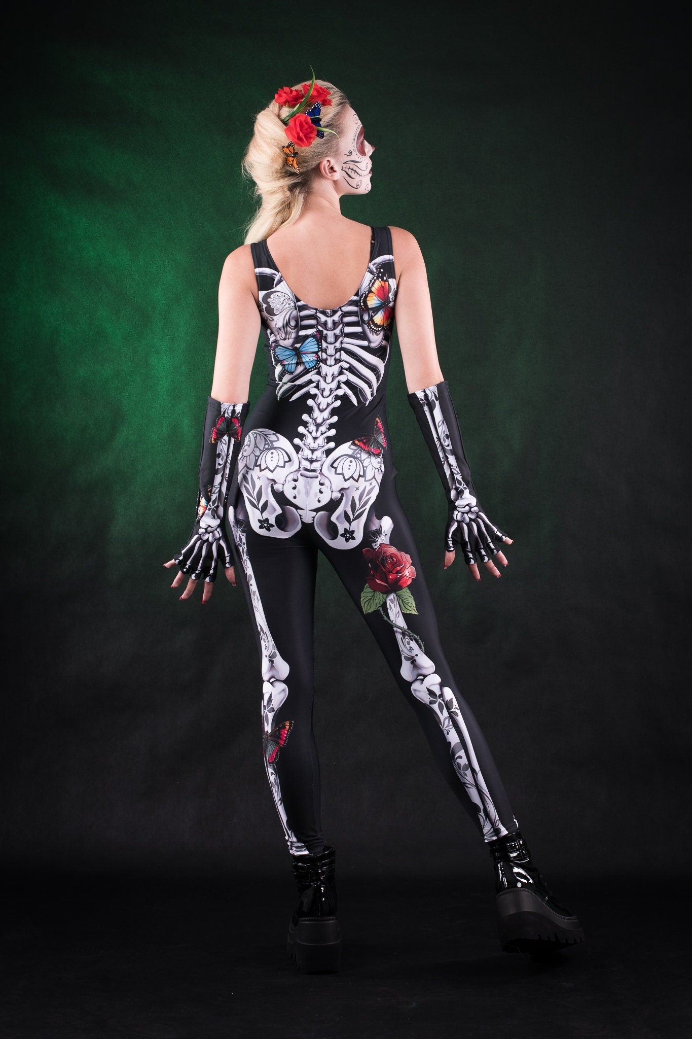 Close-up of the white skeleton design with detailed rose and butterfly accents on the jumpsuit and matching kimono, ideal for Halloween or festival fashion.