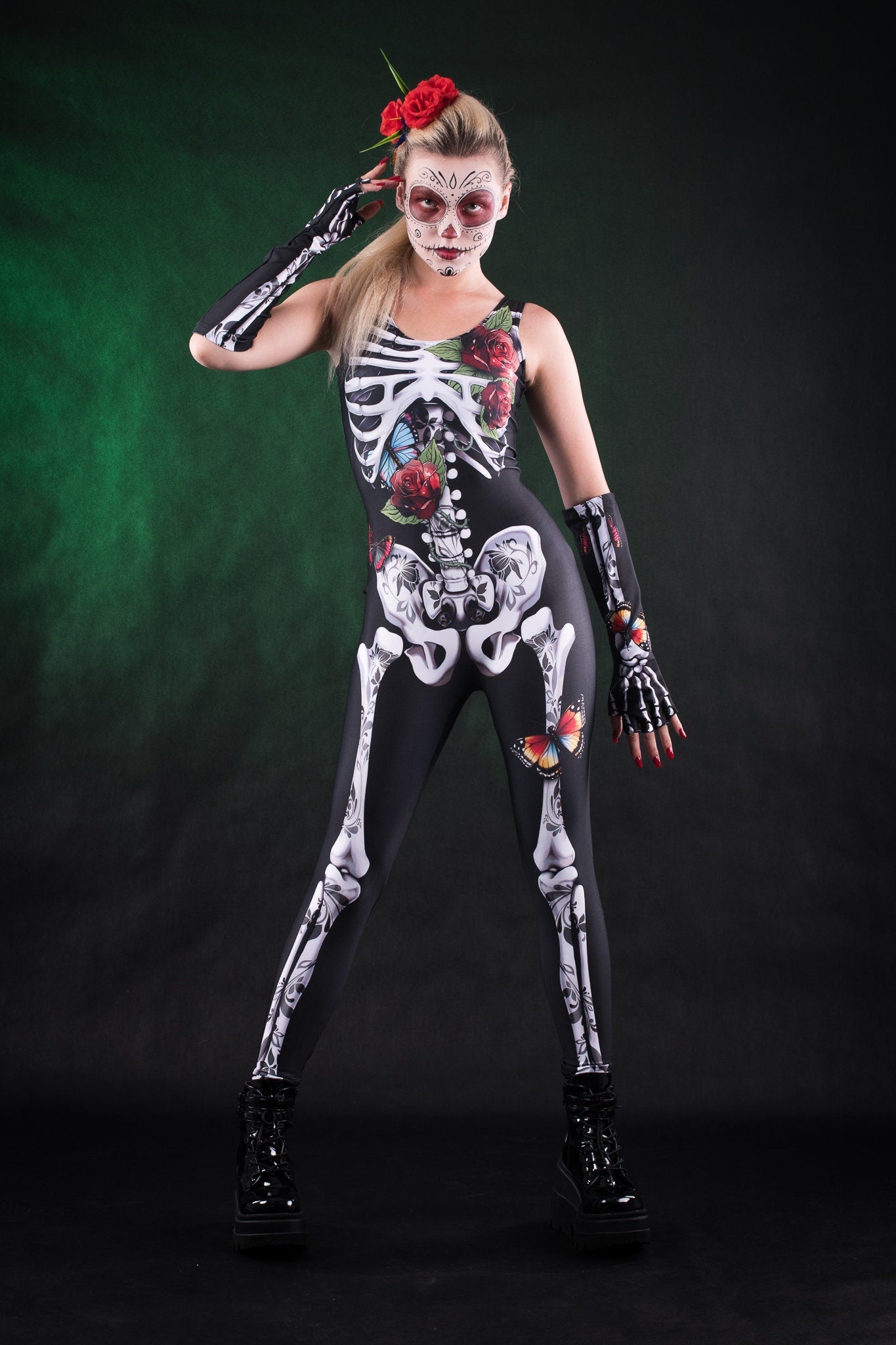 Woman posing in the Roses Butterflies Skeleton jumpsuit with kimono, highlighting the vibrant floral and skeleton design, great for Halloween or as a standout festival outfit.