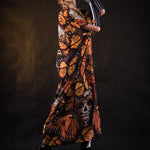 Woman wearing the Orange Butterflies Skeleton costume with kimono, featuring a white skeleton bodysuit and orange butterfly accents, perfect for Halloween or Day of the Dead celebrations.