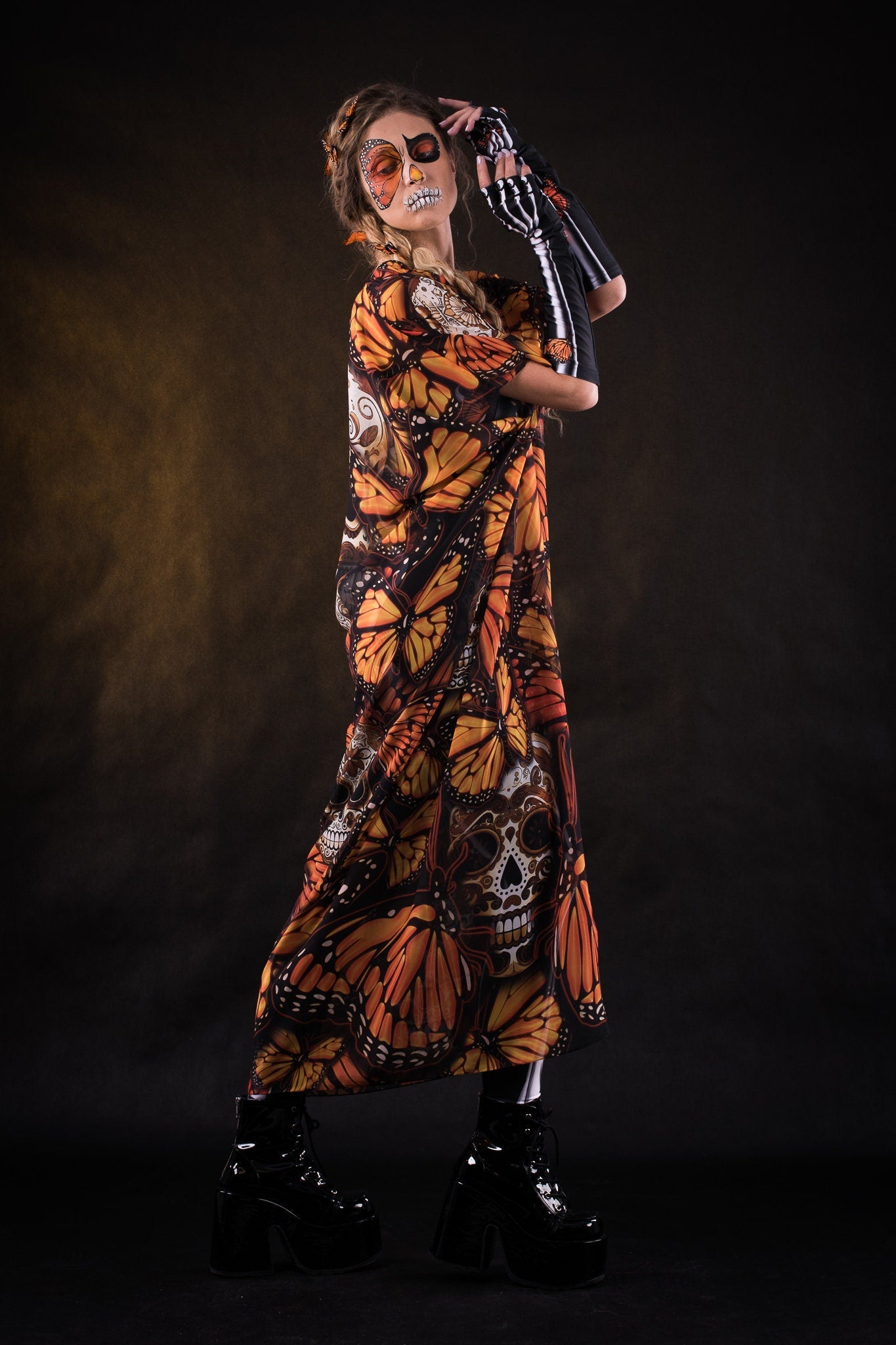 Woman wearing the Orange Butterflies Skeleton costume with kimono, featuring a white skeleton bodysuit and orange butterfly accents, perfect for Halloween or Day of the Dead celebrations.