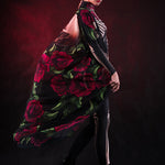 Woman wearing the Lady Death kimono Halloween cape, featuring a black cape with skull and rose accents, perfect for Halloween or Day of the Dead events.